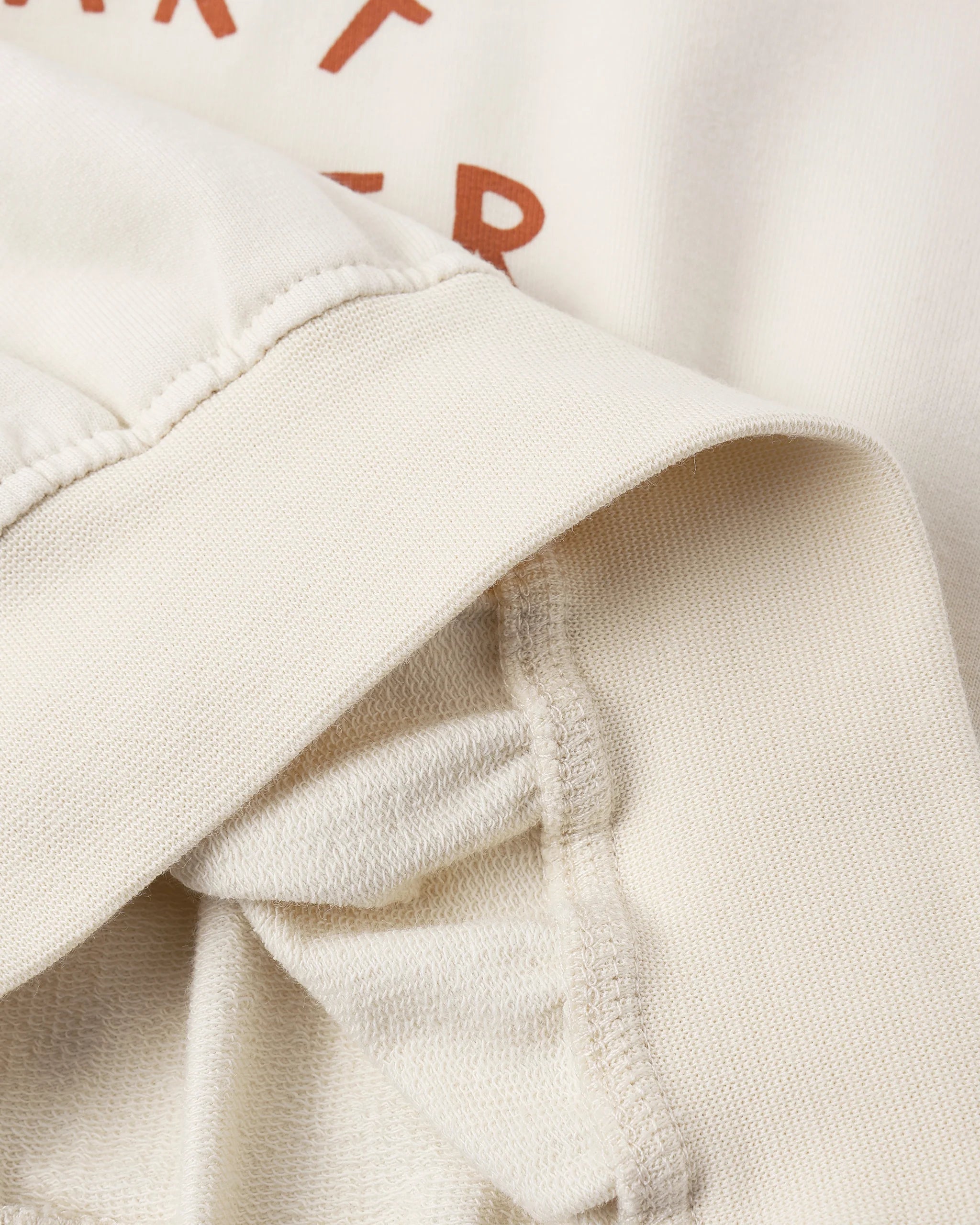 Close-up of beige fabric with a textured pattern