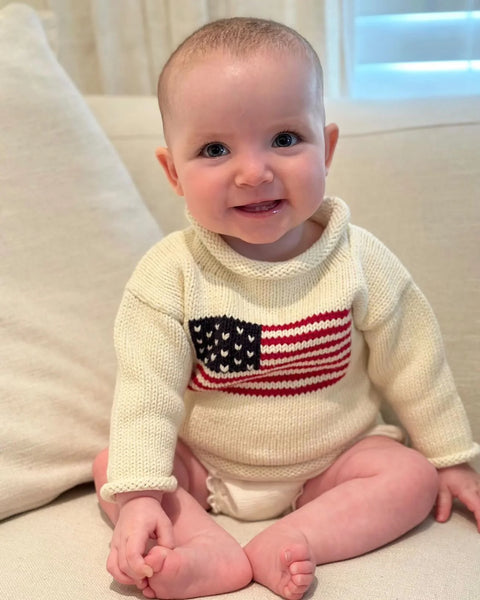 baby wearing ivory american flag sweater