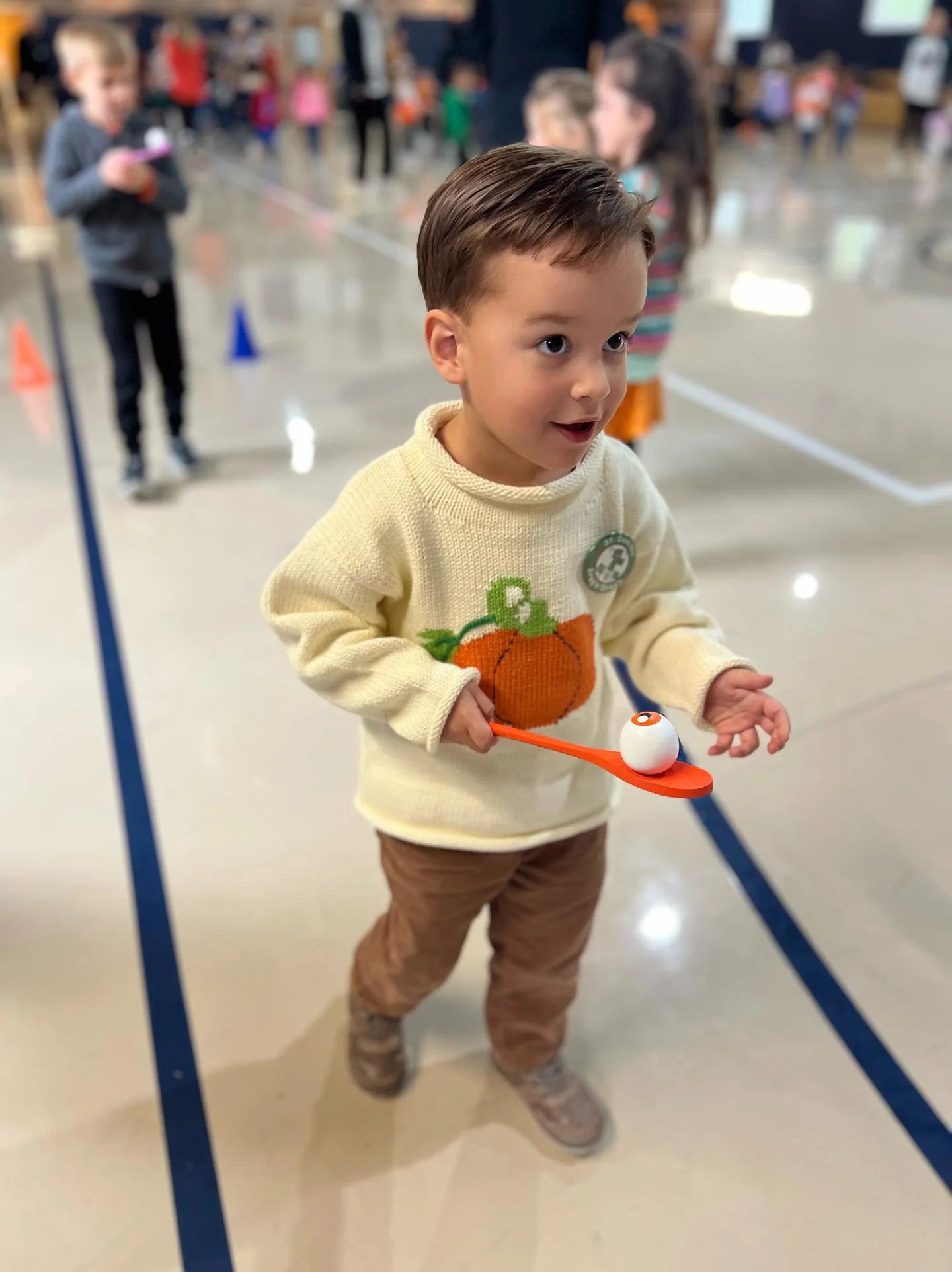 ivory long sleeve sweater with orange pumpkin