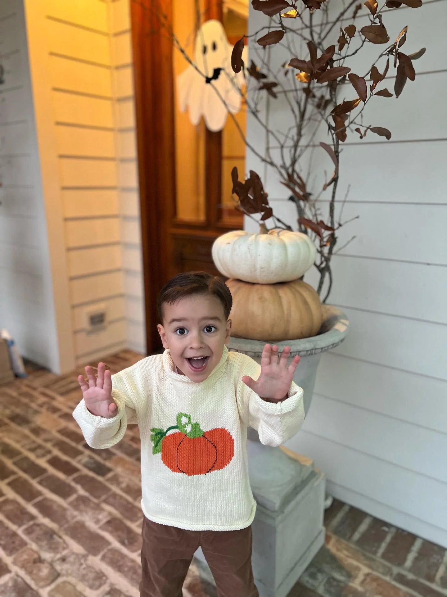 ivory long sleeve sweater with orange pumpkin