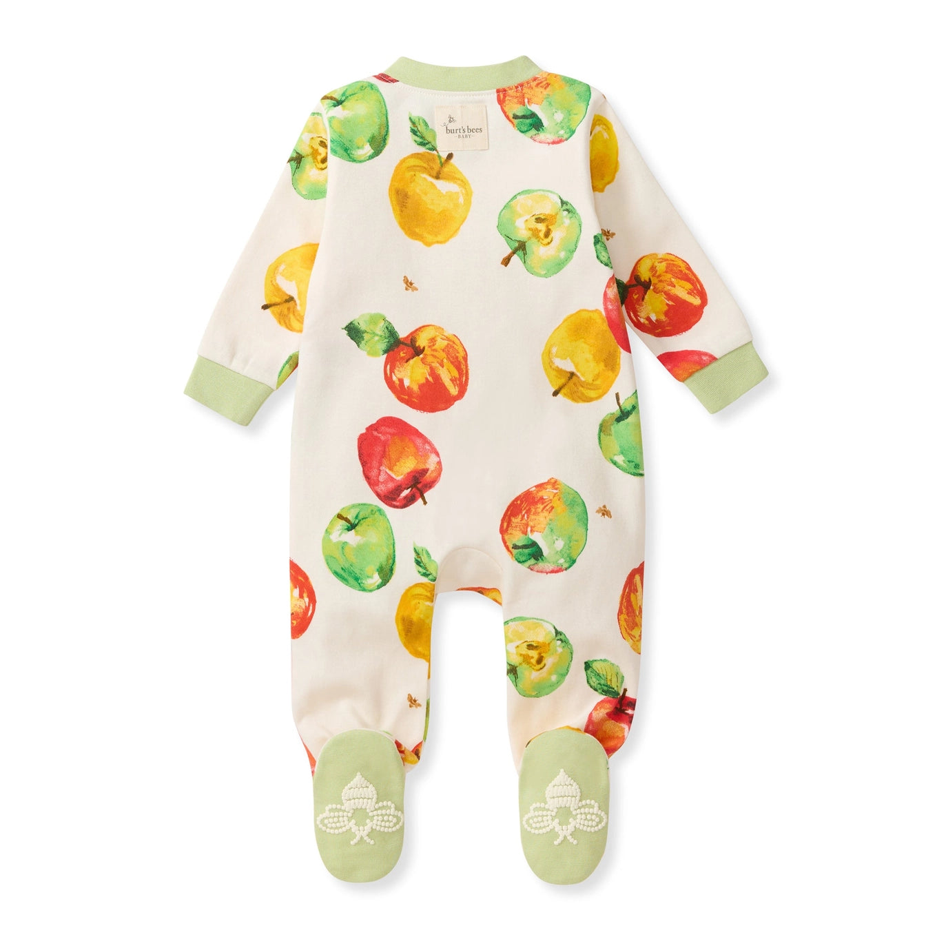 A baby footed sleeper with long sleeves and legs, featuring an all-over watercolor apple print in green, red, and yellow on an off-white background, with light green cuffs and footies.