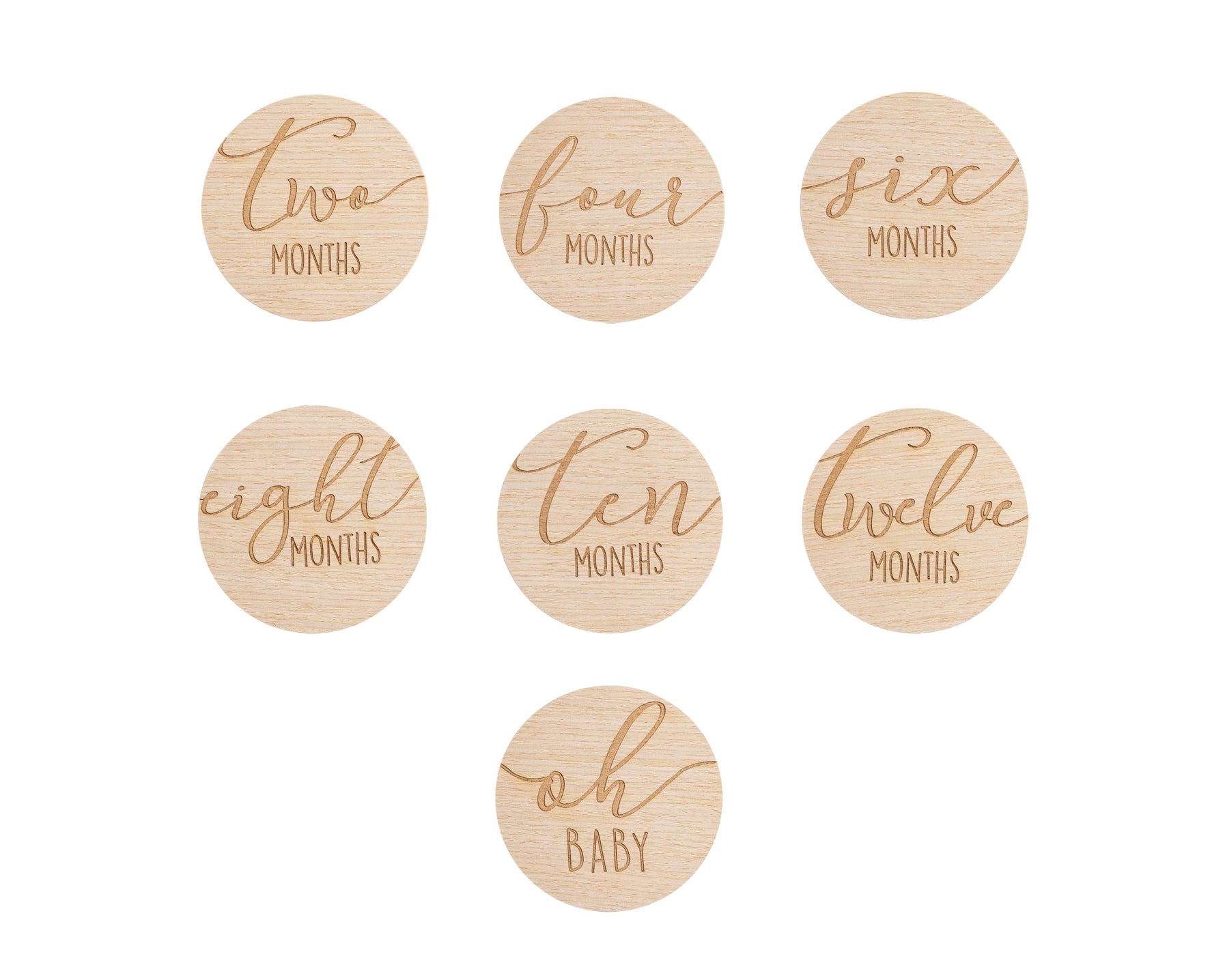 Set of wooden discs with milestone text for baby&