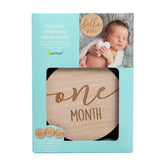 Baby milestone photo card set with wooden disc and baby photo, Pearhead brand visible
