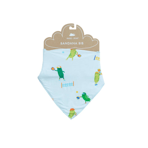 blue bib with green pickles playing pickleball