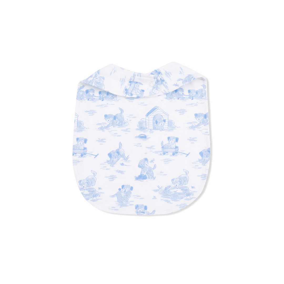 Baby bib with blue dog pattern on a white background