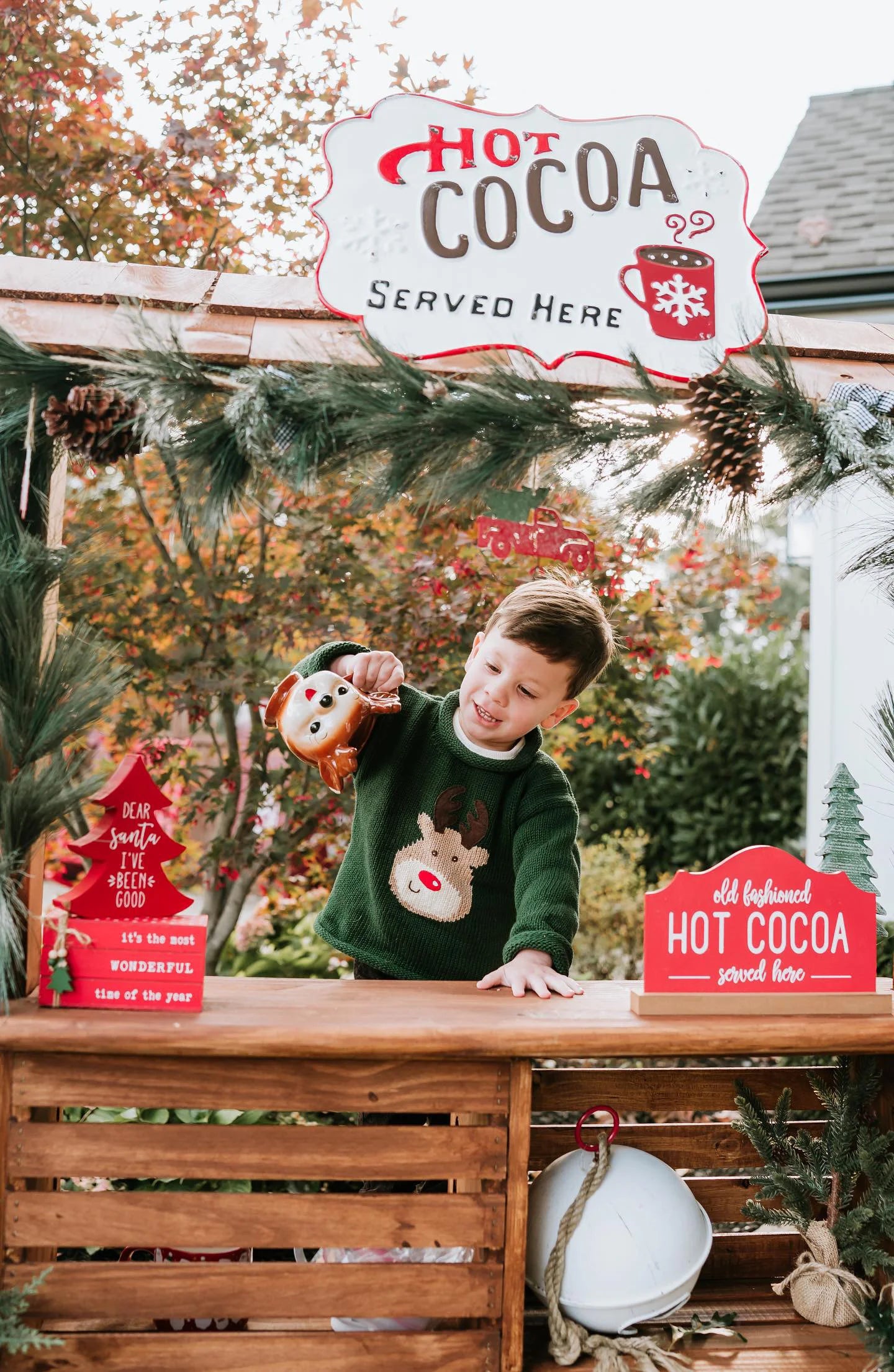 boy wearing rudolph sweater