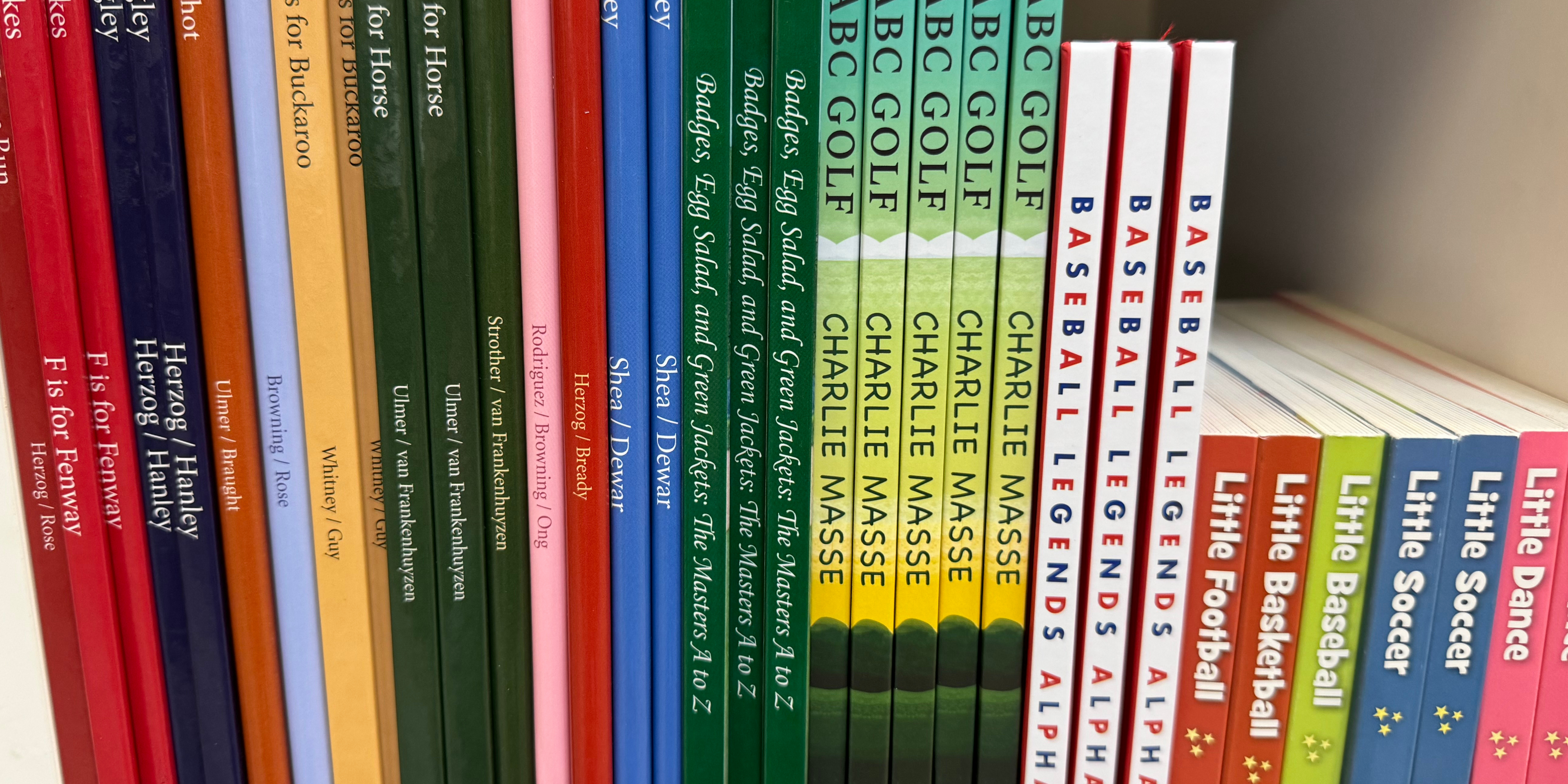 shows different children's books on a shelf