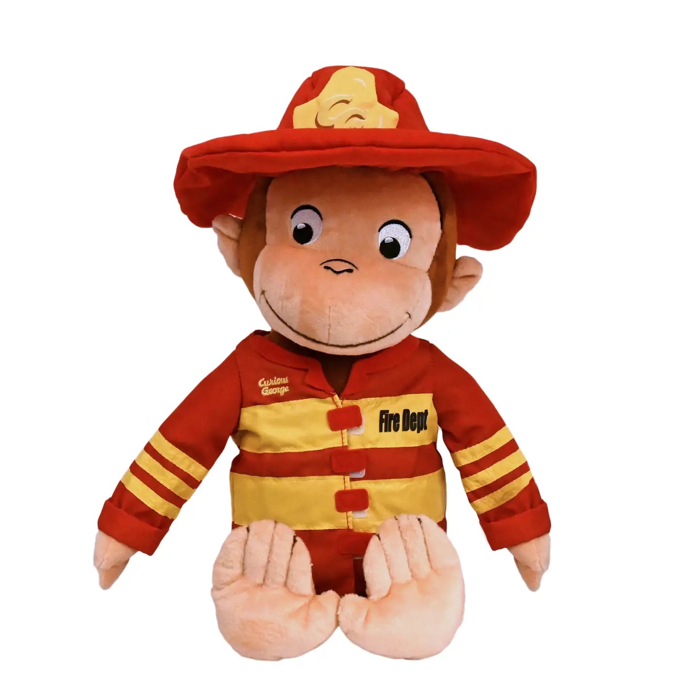 Plush monkey toy dressed as a firefighter on a white background