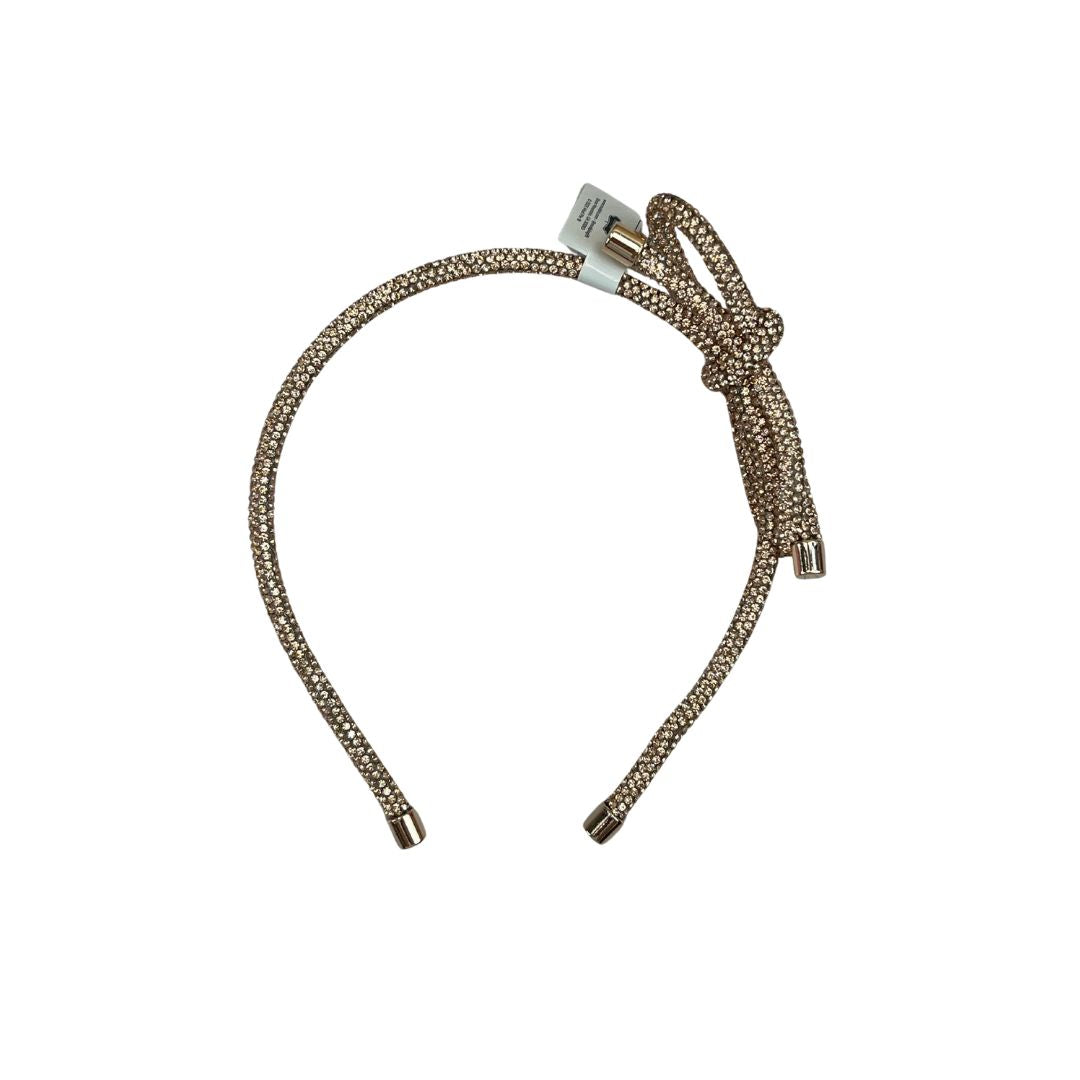 Rose gold headband with crystals on a white background