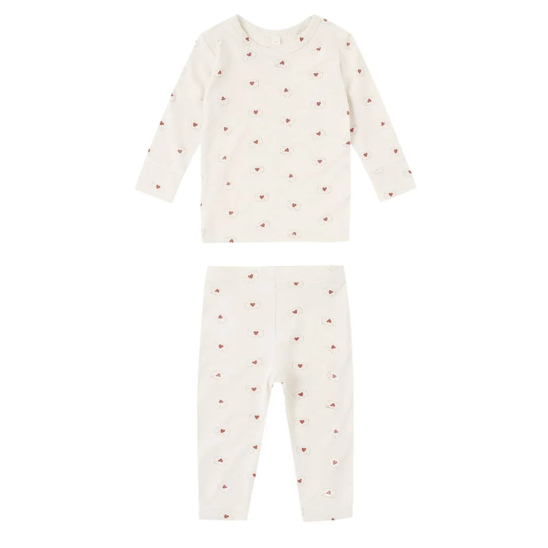 Baby pajamas with heart pattern on a white background