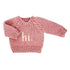 Pink knitted sweater with &