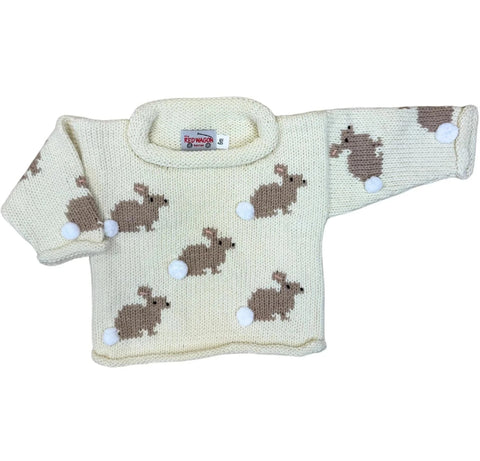 ivory roll neck sweater with tan bunnies knitted all over, each bunny has a white pom pom sewn on as their tail