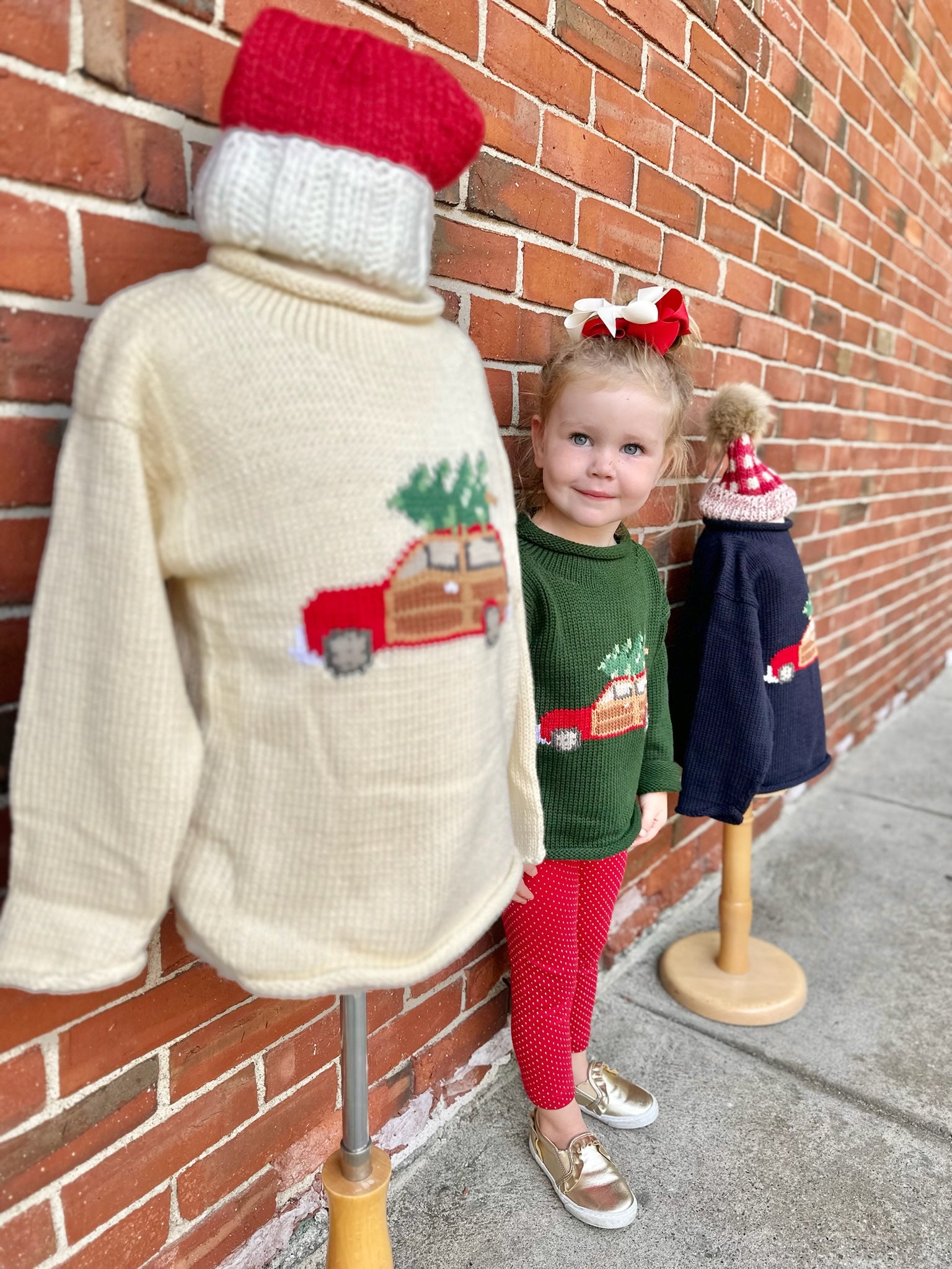 girl wearing christmas sweater