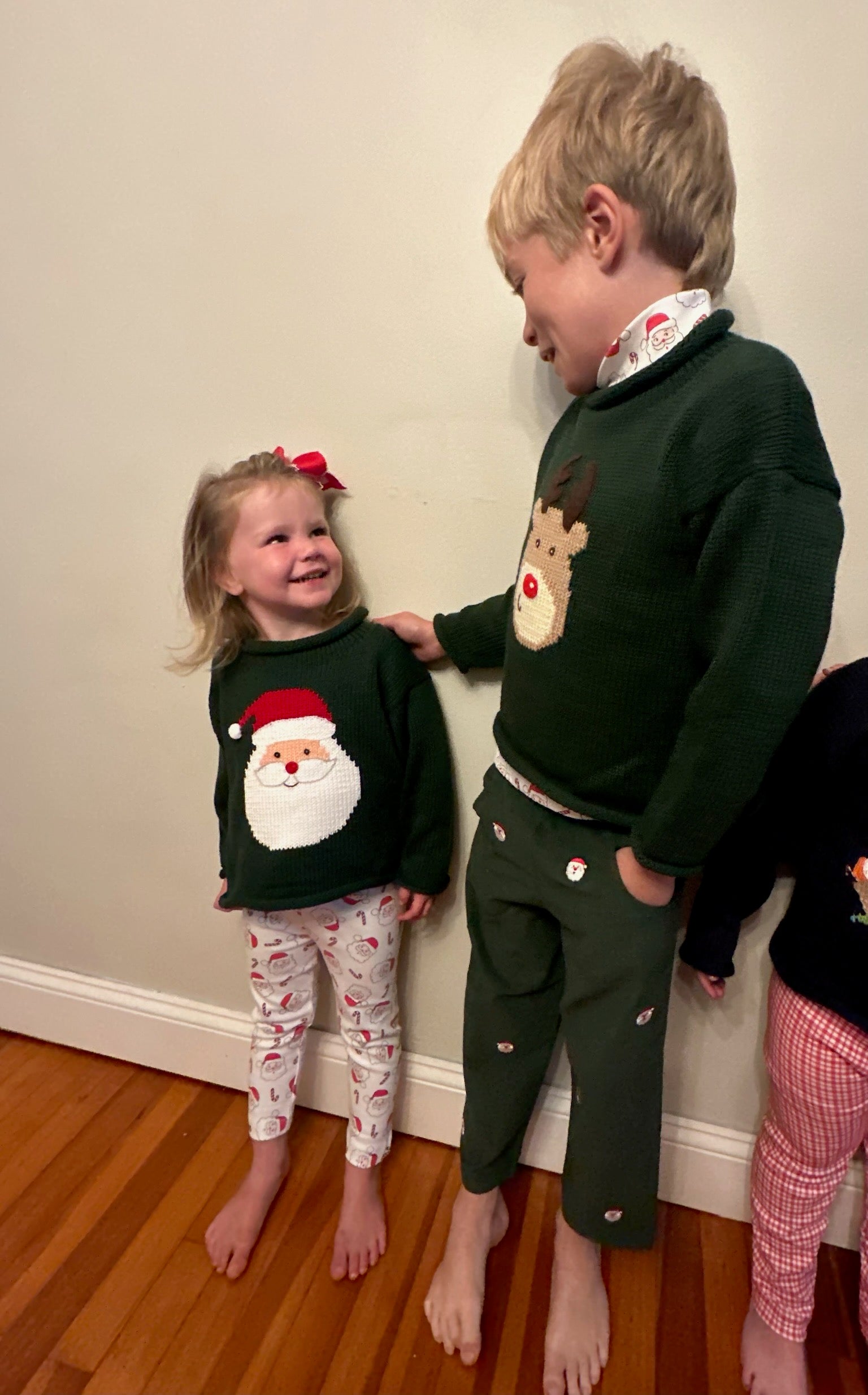 kids wearing christmas sweaters