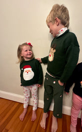 kids wearing christmas sweaters