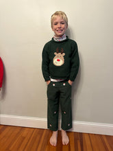 boy wearing rudolph sweater and rudolph pants