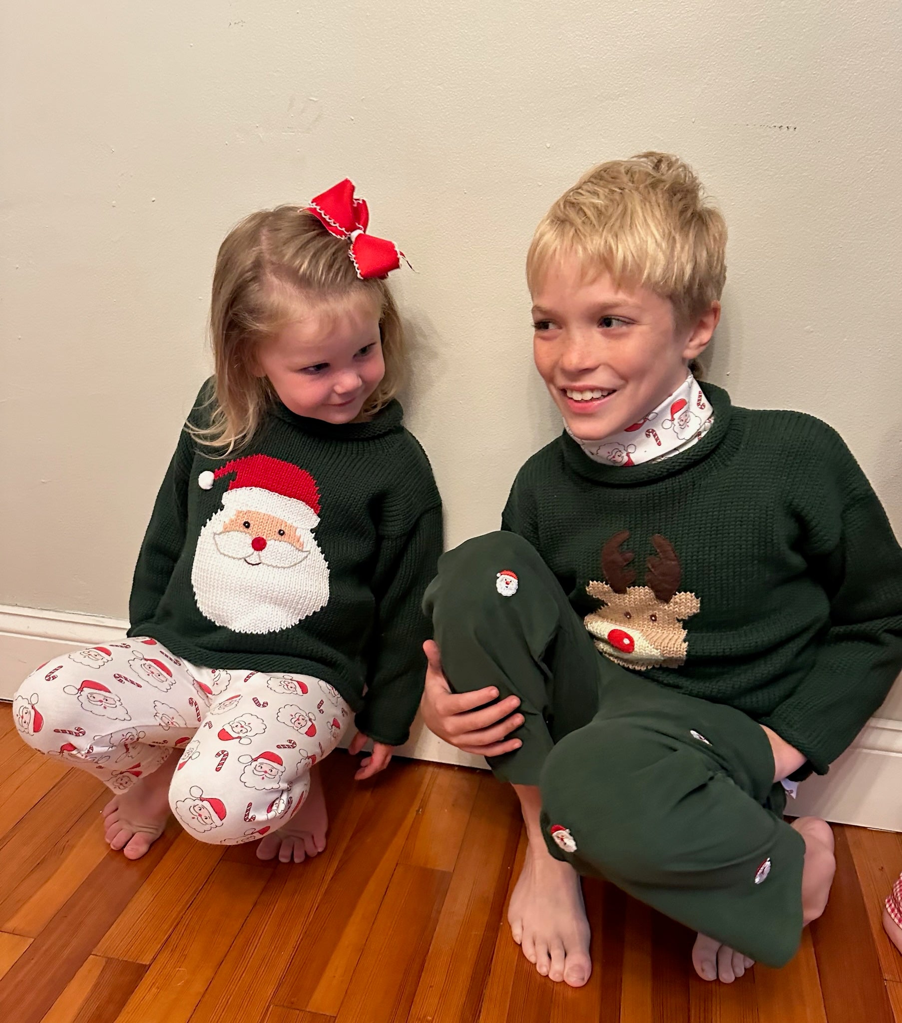 kids wearing christmas sweaters