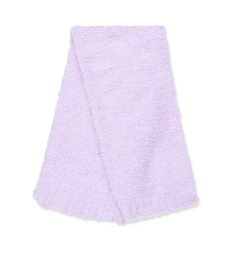 A light purple textured blanket folded neatly on a solid white background.