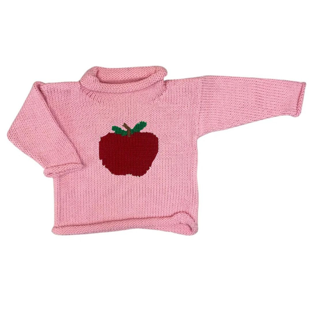 A pink ribbed knit roll neck sweater with a red apple and green leaf motif on the chest, displayed against a plain white background.