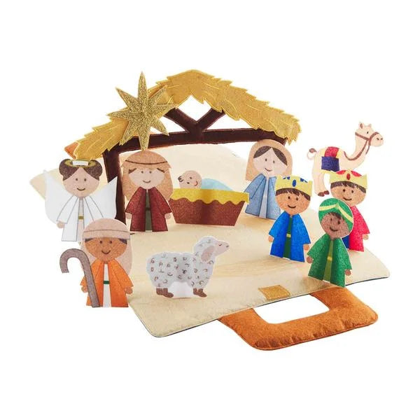 Felt nativity scene with characters and stable on a white background