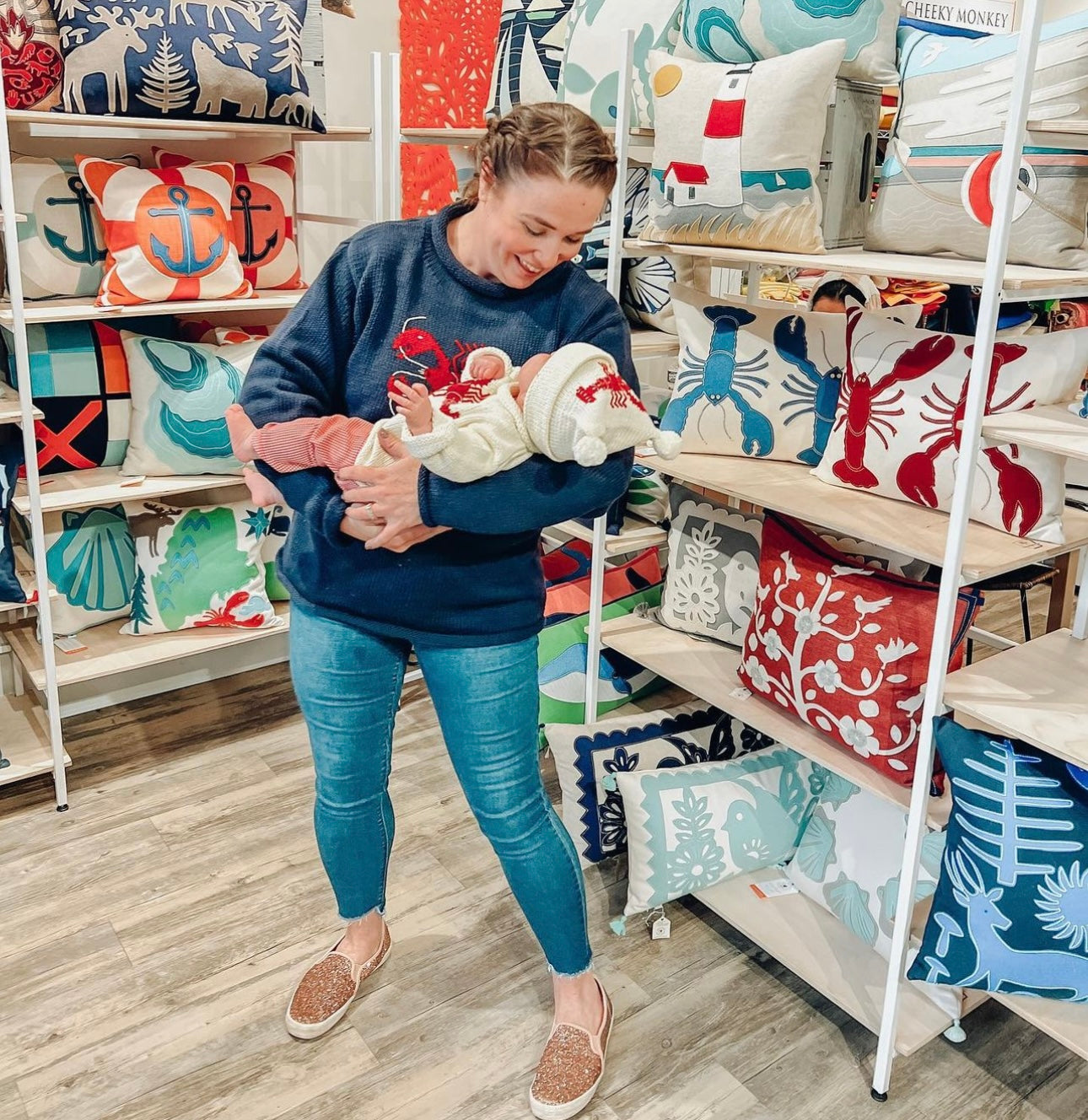 mom wearing navy lobster sweater and daughter is wearing ivory lobster sweater