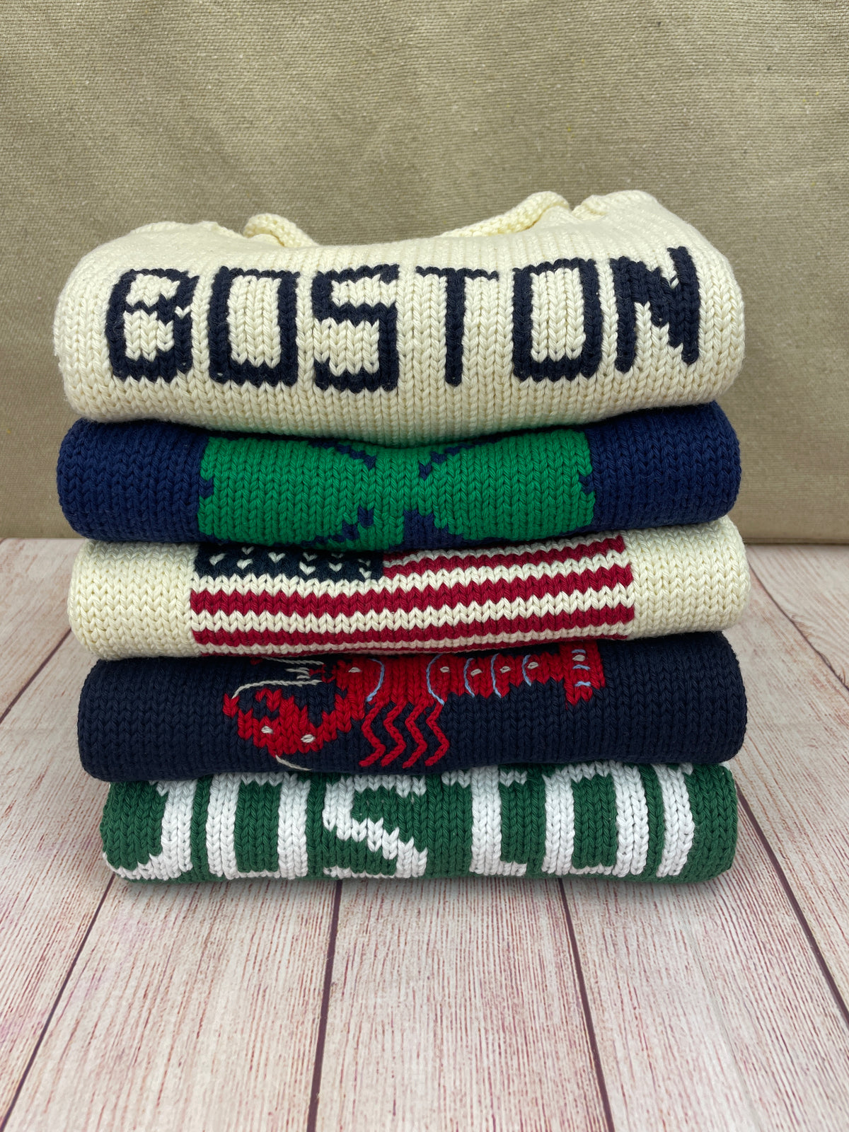 stack of new england sweaters