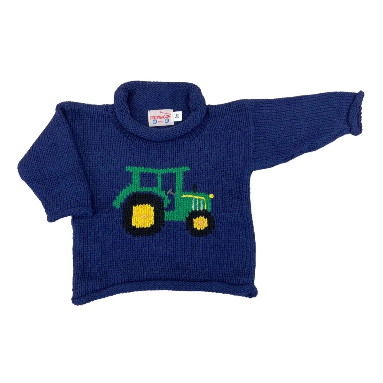 navy roll neck sweater with green tractor with black and yellow wheels