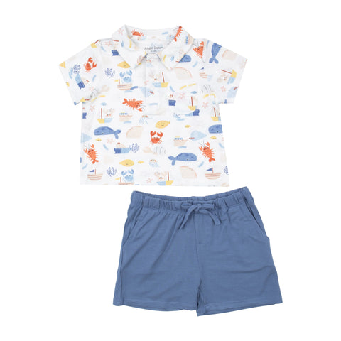 white ocean print polo shirt and matching blue shorts