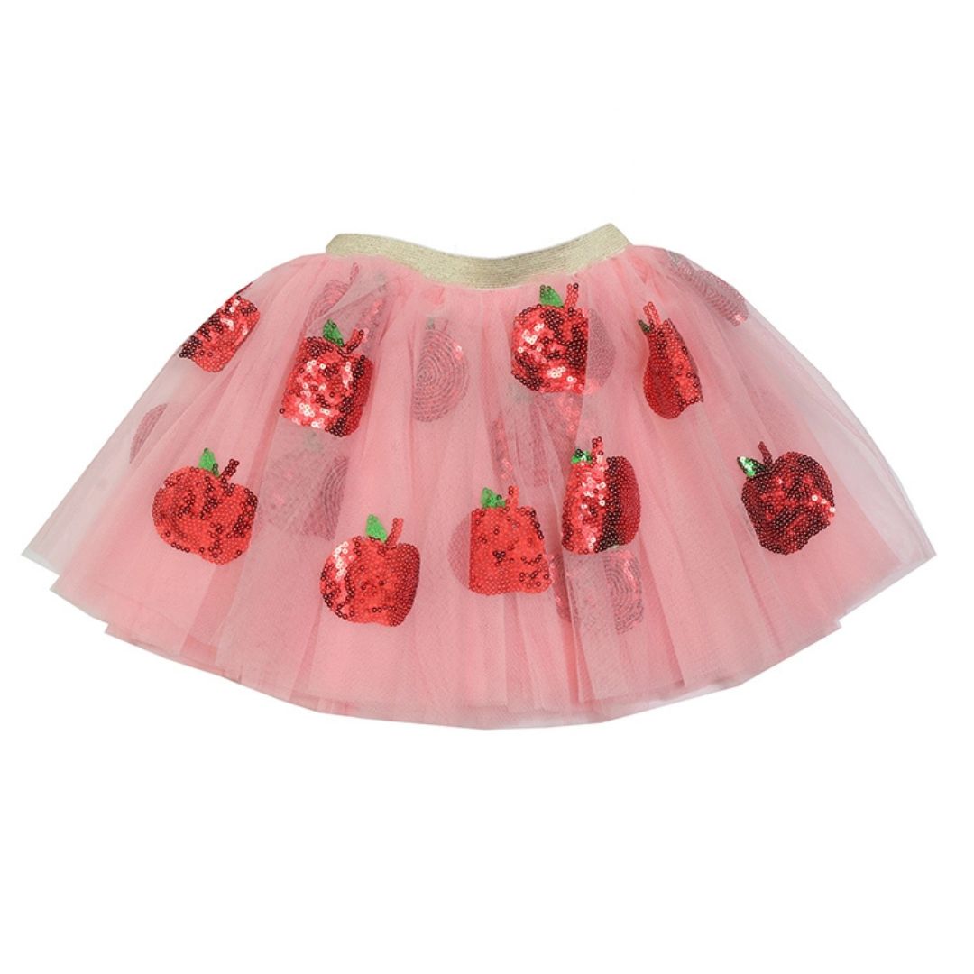 Pink tutu skirt with sequin apples on a white background