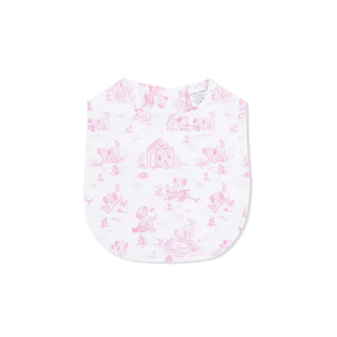 Baby bib with pink dog pattern on a white background