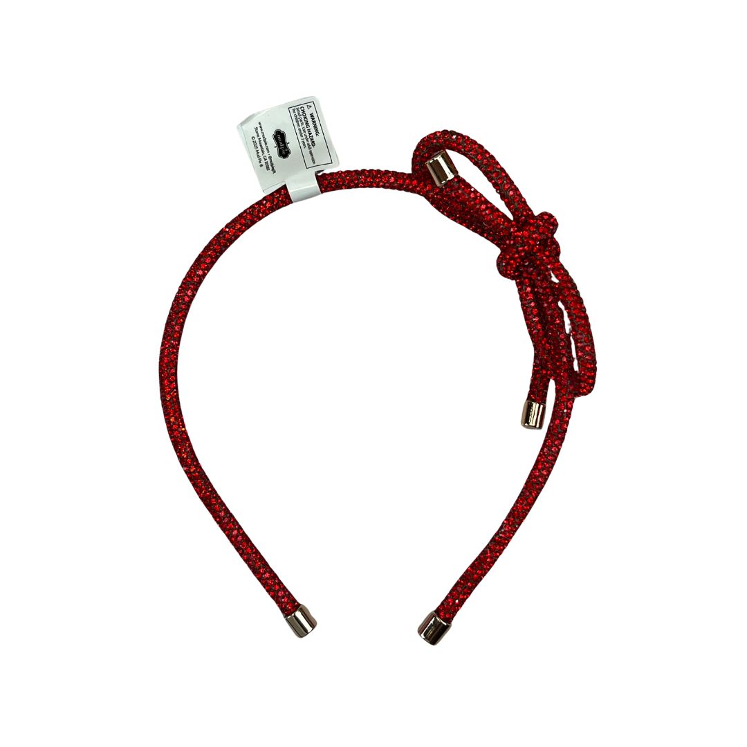 Red braided headband with gold ends on a white background