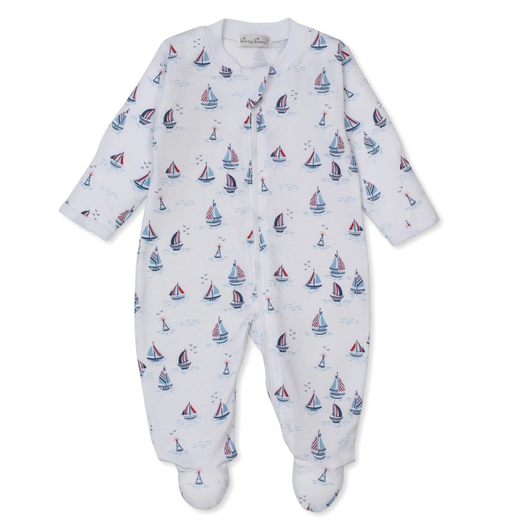 Baby onesie with sailboat pattern on a white background