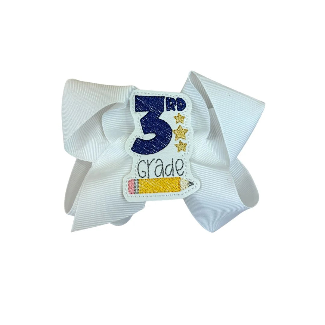 white hair bow with 3rd grade and pencil detail in center