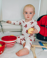 baby wearing lobster pajamas