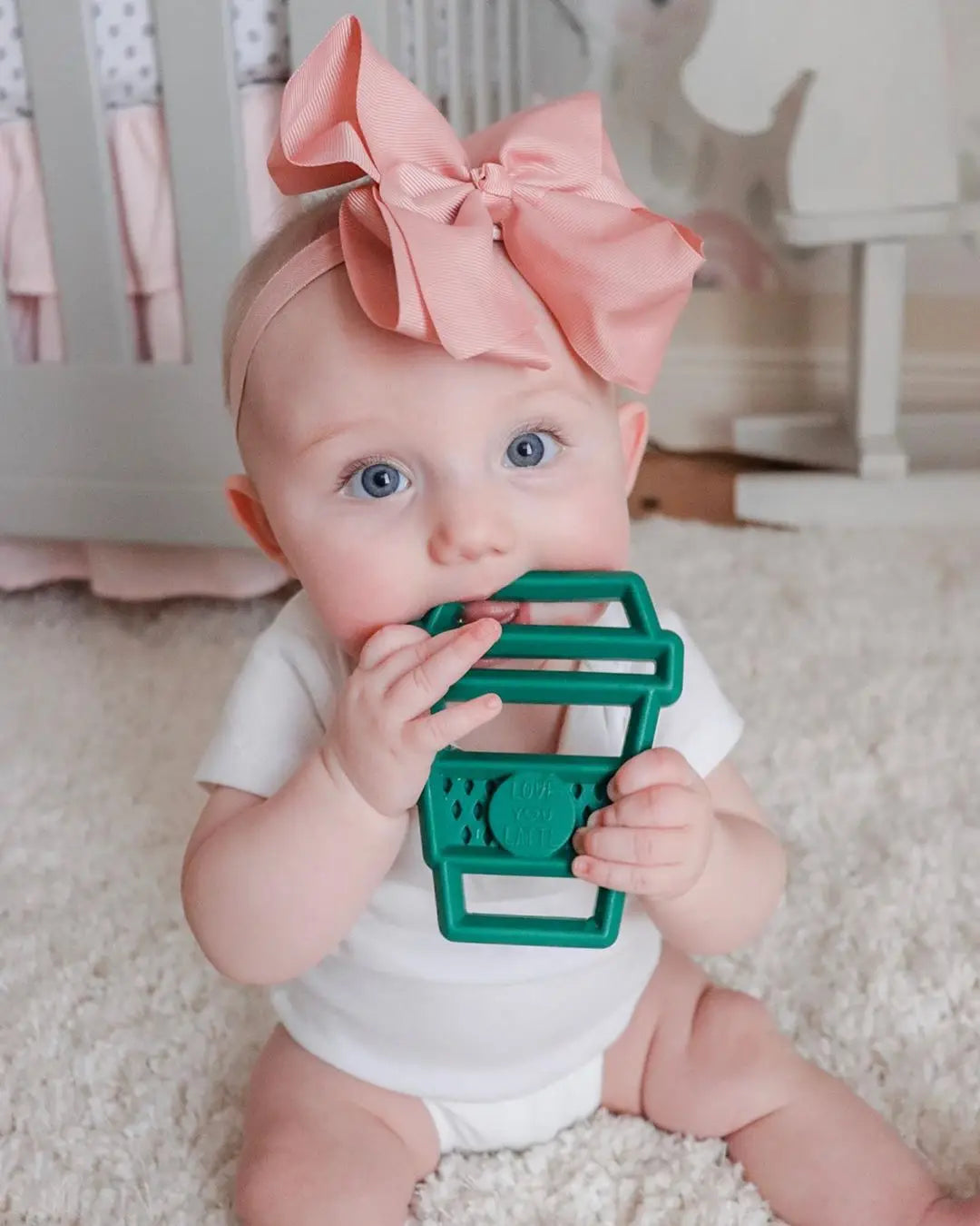 baby chewing on teether