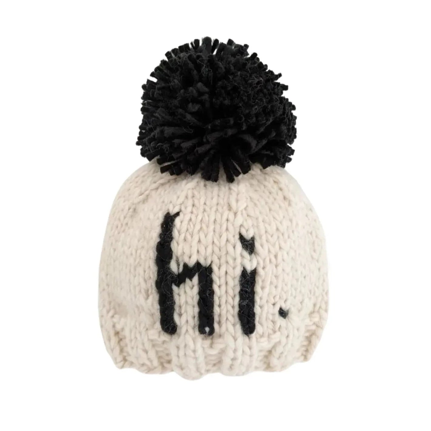 ivory hat with black "hi" knitted on and black pom at top