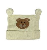 matching hat, ivory with light brown bear face in center and two ivory poms at top, hat is rolled up once at bottom