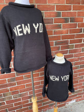 shows adult and kids matching new york sweaters