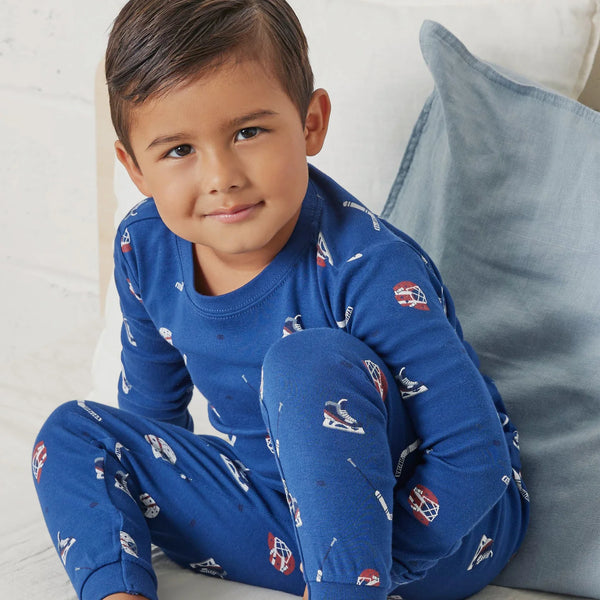 blue pajamas with hockey gear all over