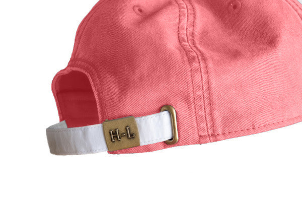 red baseball cap with East Coast embroidered on it