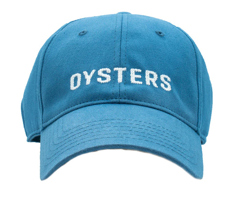 blue baseball cap with Oysters written on it