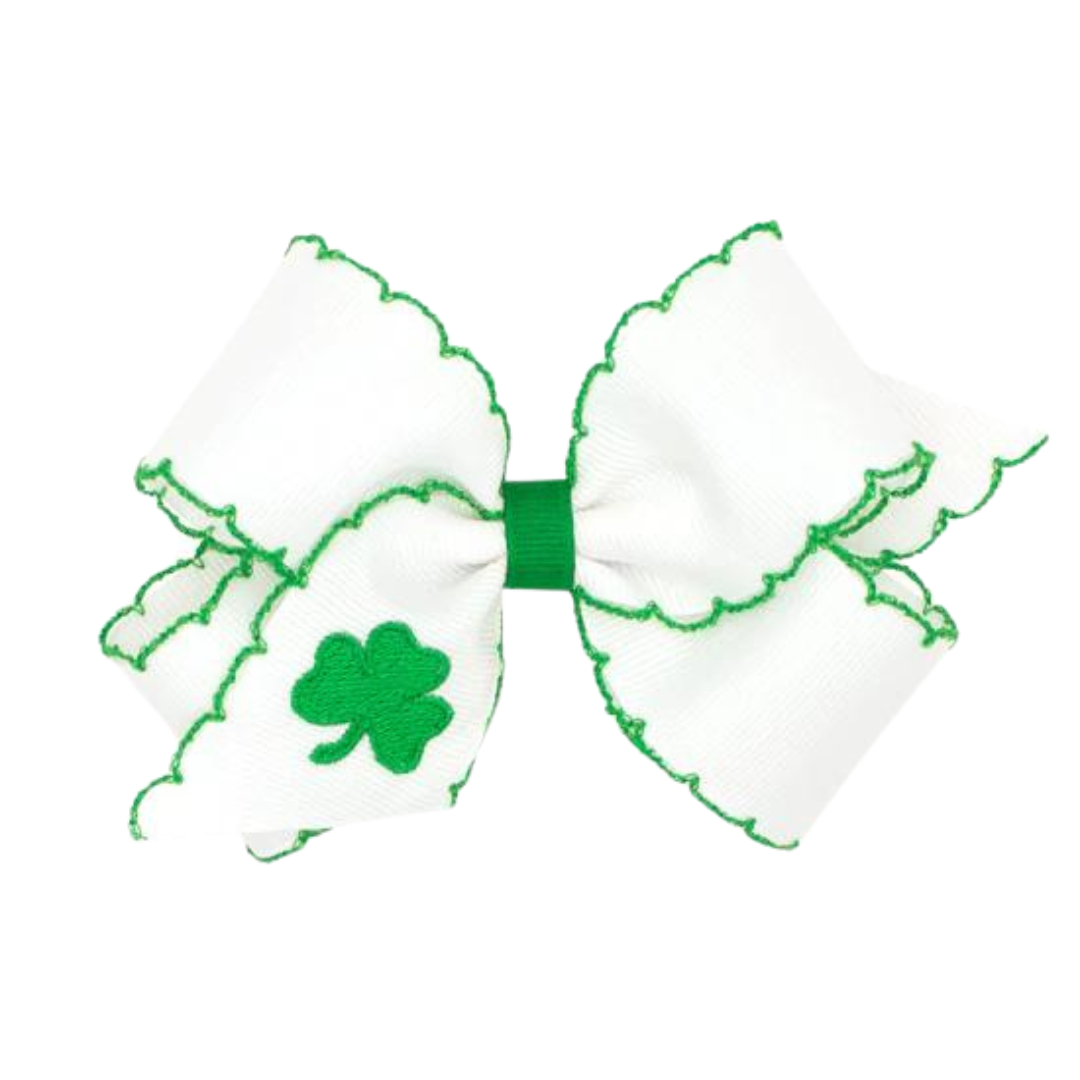 white bow with green trim and green embroidered shamrock