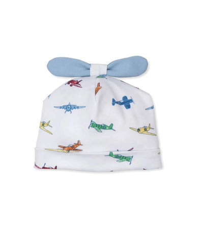 white baby hat with green, blue, orange, red and yellow airplanes all over, with blue propellor at top of hat