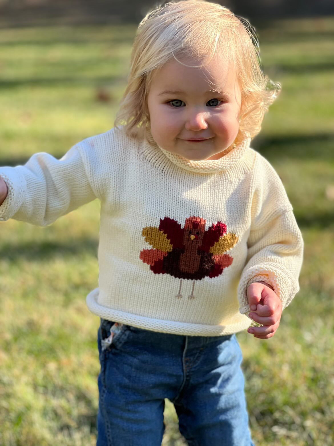 girl wearing turkey sweater