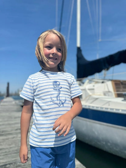 boy wearing the shirt on a dock