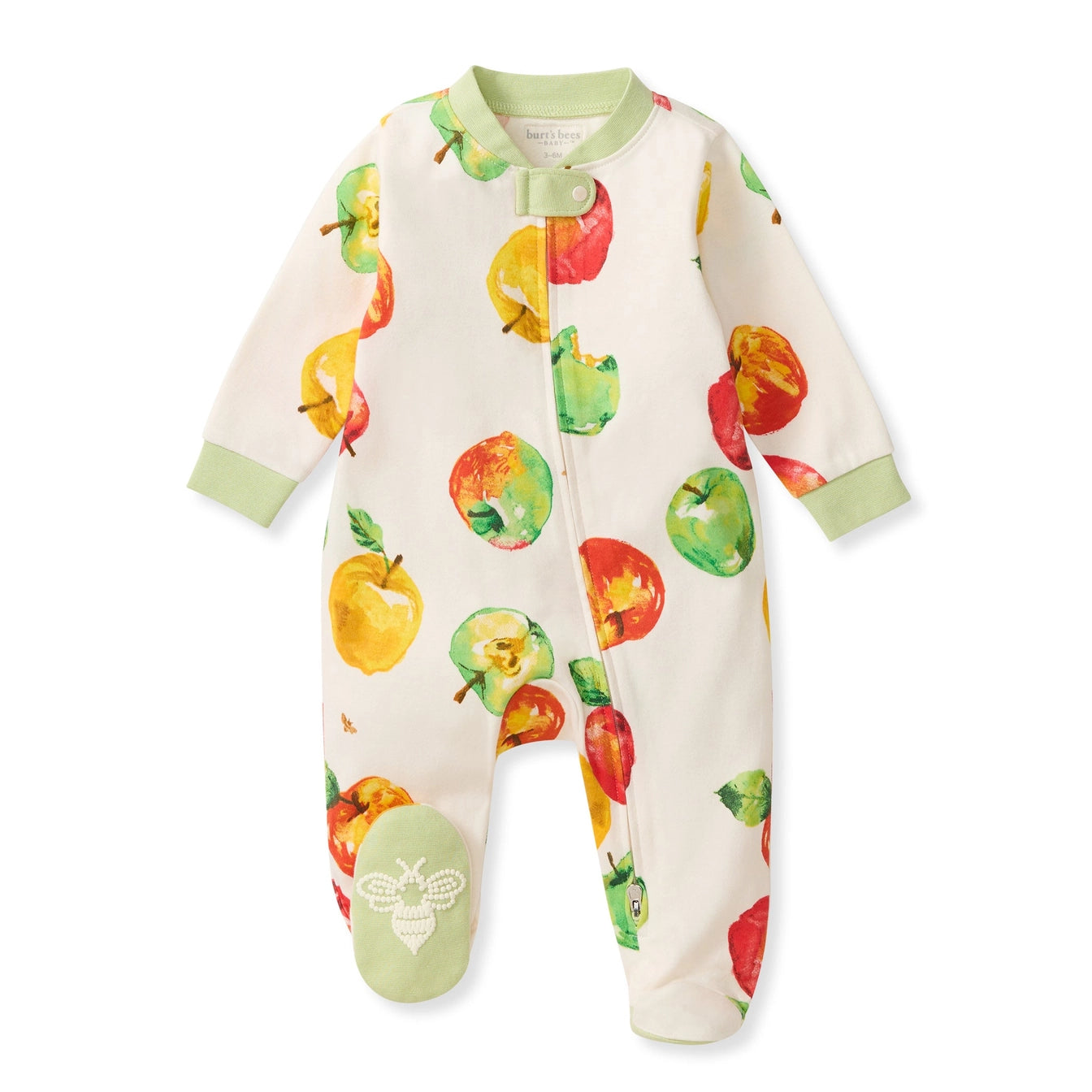 A baby long-sleeve footed sleeper in off-white with a colorful watercolor apple print, featuring light green trim and a snap closure at the neck.