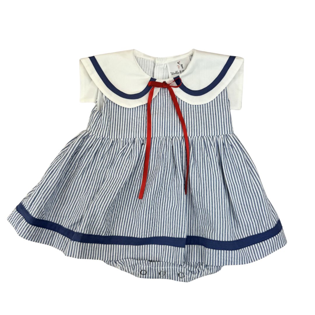Striped baby dress with a white collar and red ribbon on a white background