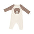 ivory romper with brown sleeves and brown bear face on chest