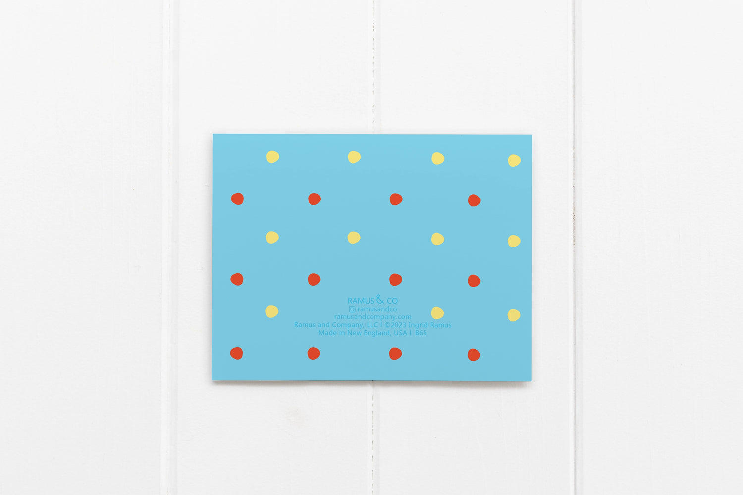 back of card has red and yellow polka dots