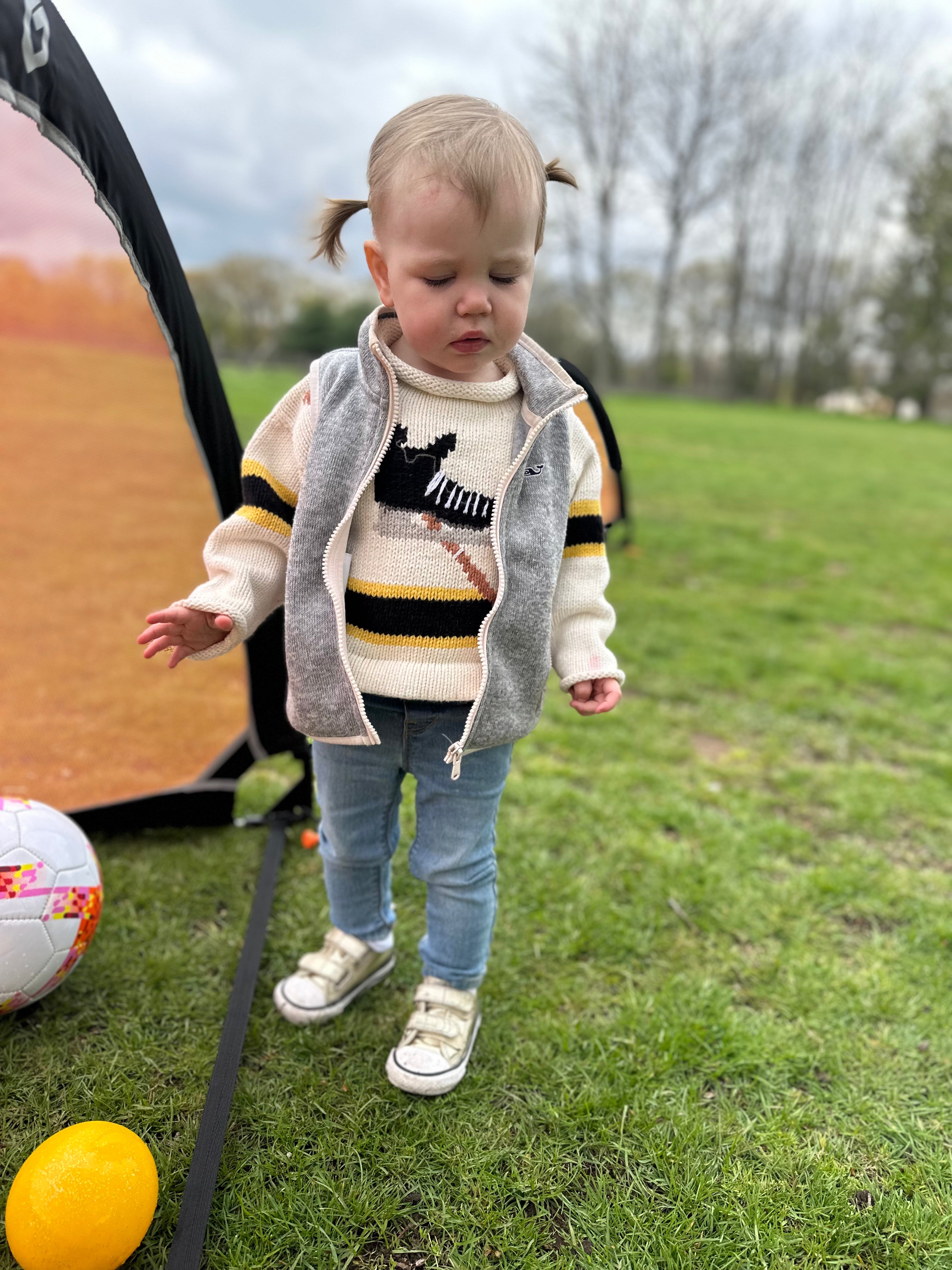 baby wearing hockey sweater